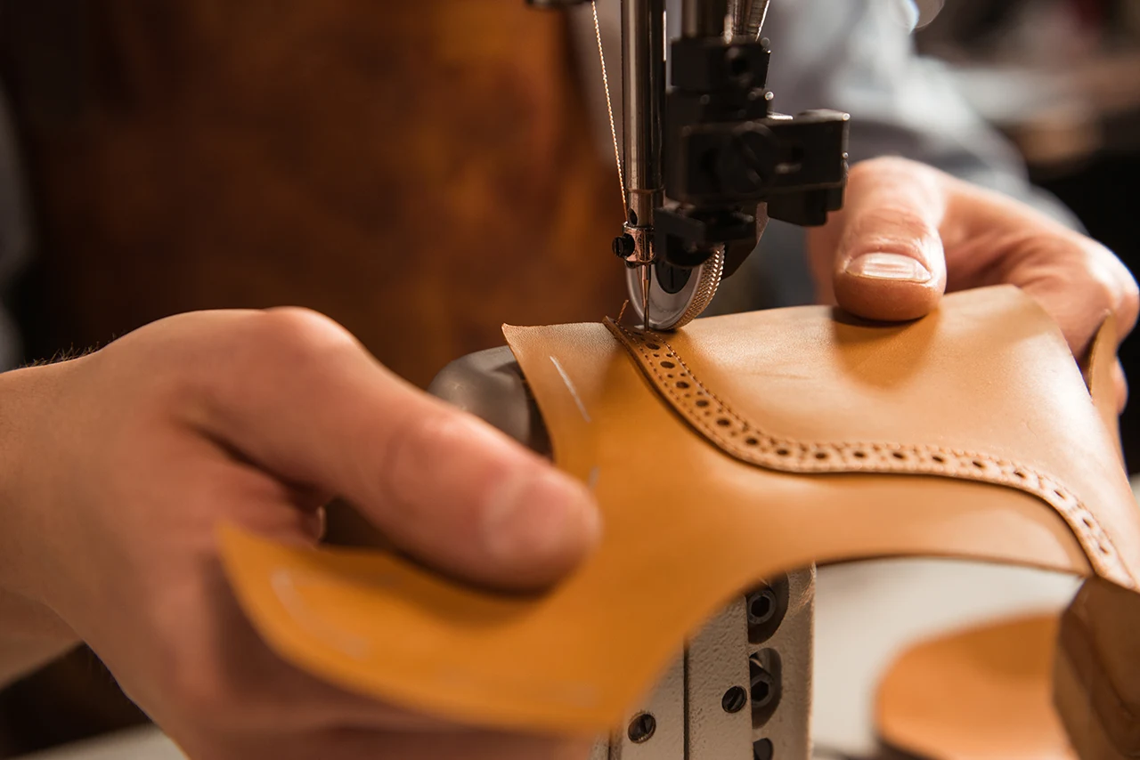 close-up-cobbler-stitching-part-shoe copy