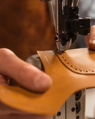 close-up-cobbler-stitching-part-shoe copy